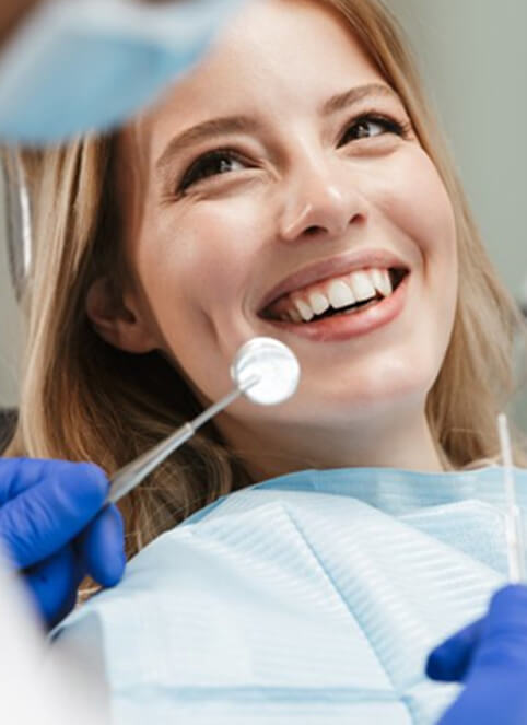 lady smiles at dentist