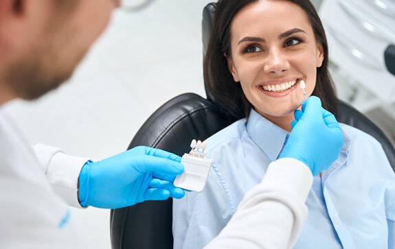 a patient during her dental consultation