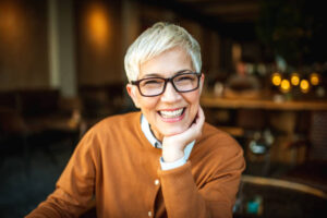 Smiling middle-aged woman in restaurant